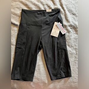 New with tags, never worn women’s bike shorts, long and seam with pockets size s